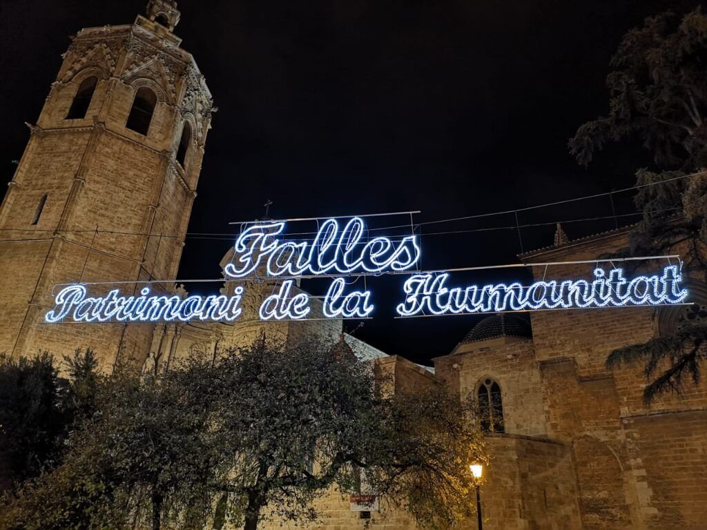 A sign of Les Falles in front of the Valencia Cathedral
