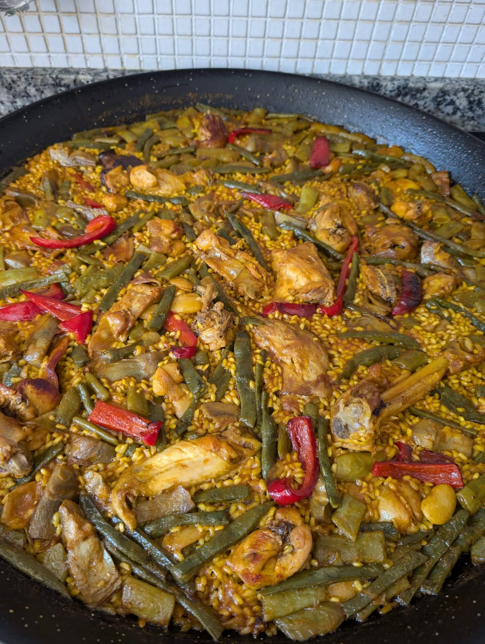 Traditional paella valenciana during one of the best food tours in Valencia.