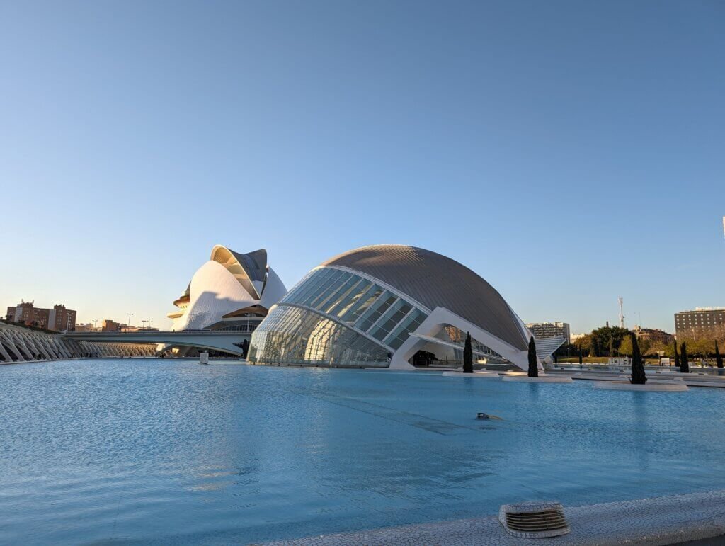 Panoramic view of the futuristic City of Arts and Sciences with modern white buildings and reflection pools