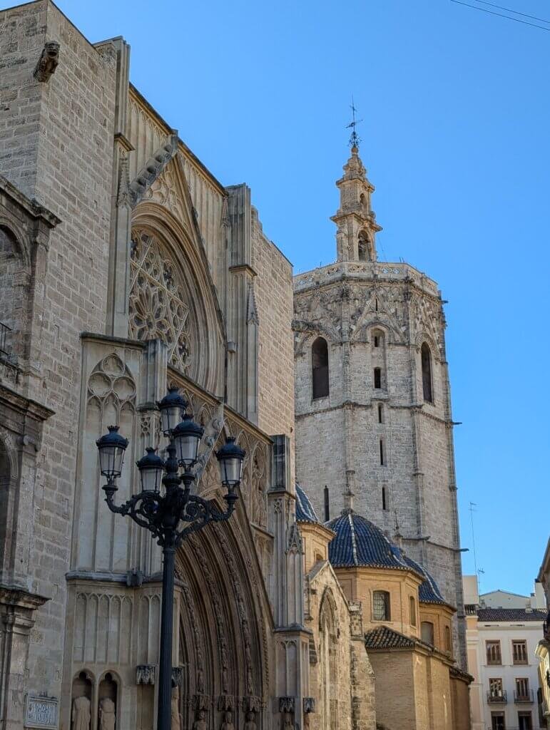View of Valencia Cathedral and the El Miguelete bell tower under a clear blue sky