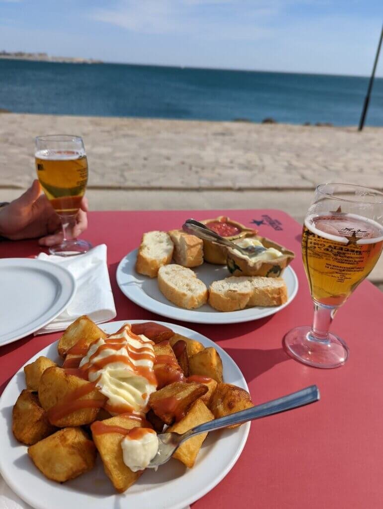 "Braves" with "pa i allioli" in front of the beach, some of the best vegetarian food in Valencia